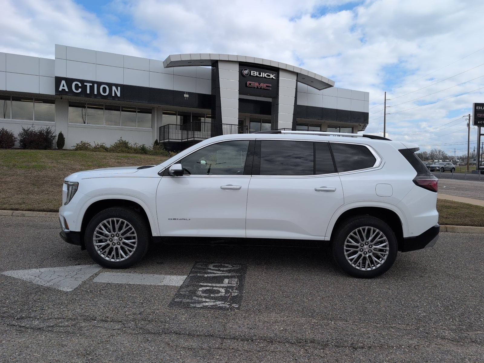 2026 GMC Acadia Denali in Summit White — front three-quarter view