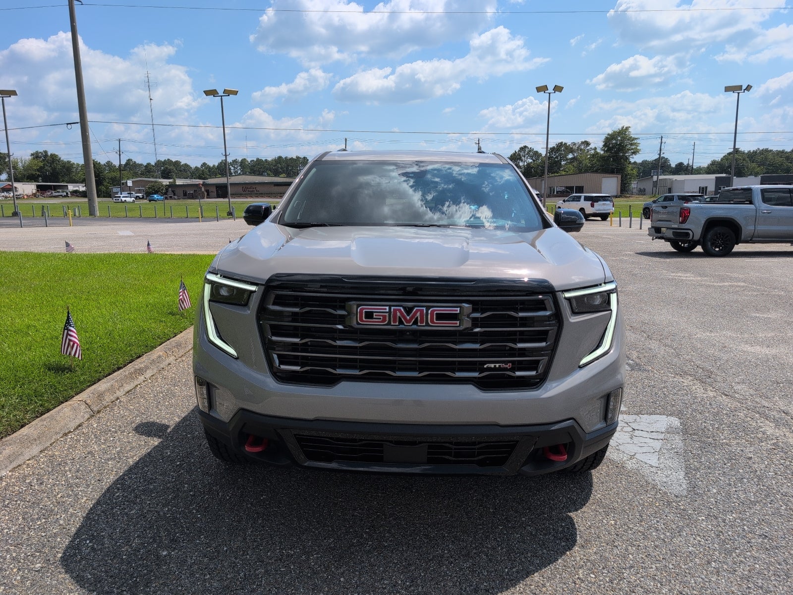 2026 GMC Acadia AT4 in Riverstone Metallic — front three-quarter view