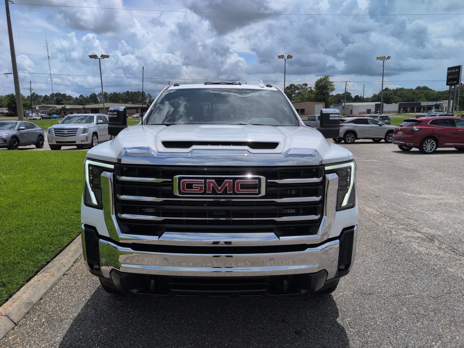 2026 GMC Sierra 2500 HD SLT in Summit White — front three-quarter view