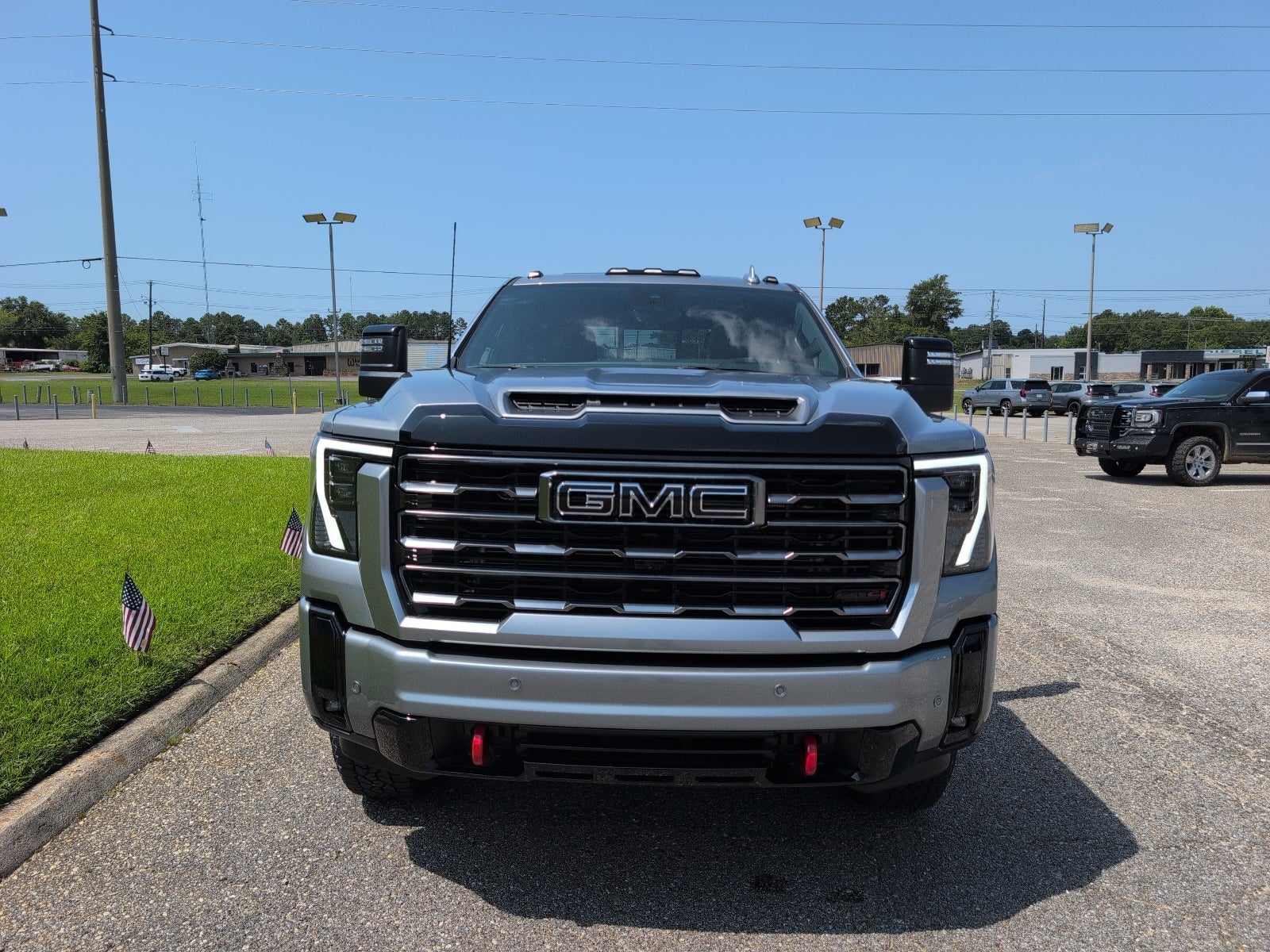 2026 GMC Sierra 2500 HD AT4 in Sterling Metallic — front three-quarter view
