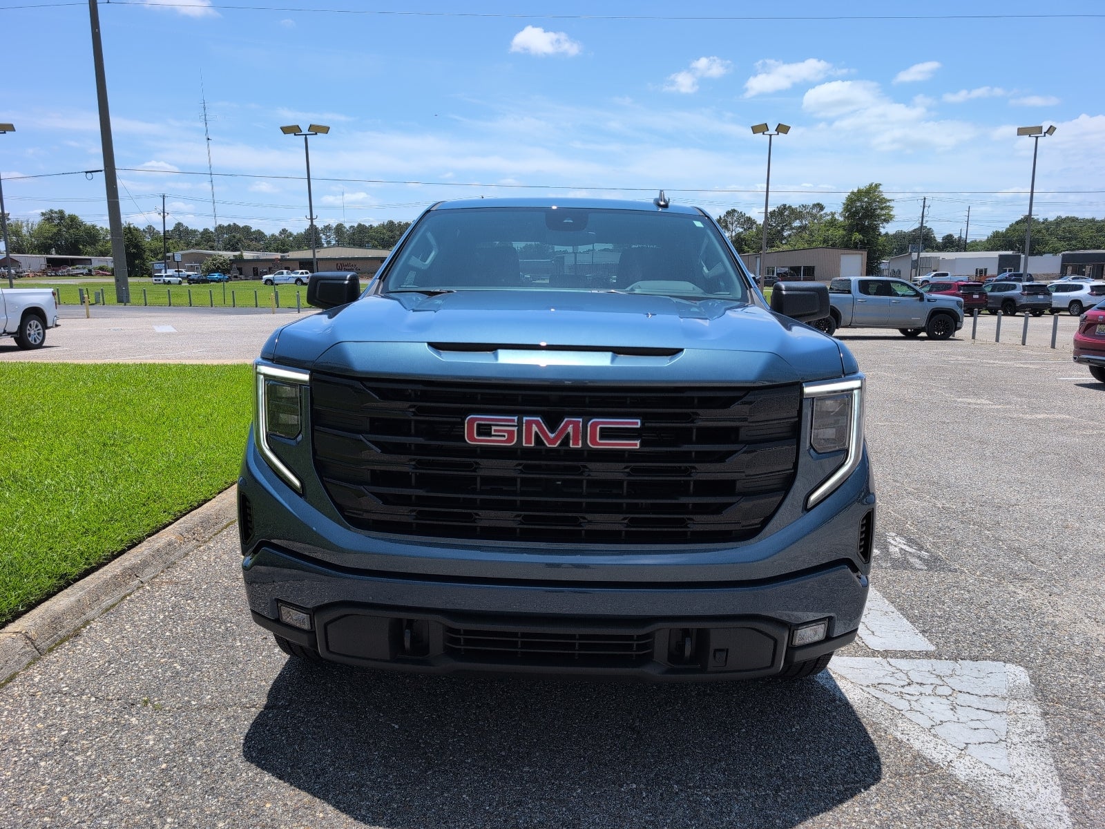 2026 GMC Sierra 1500 Elevation in Downpour Metallic — front three-quarter view