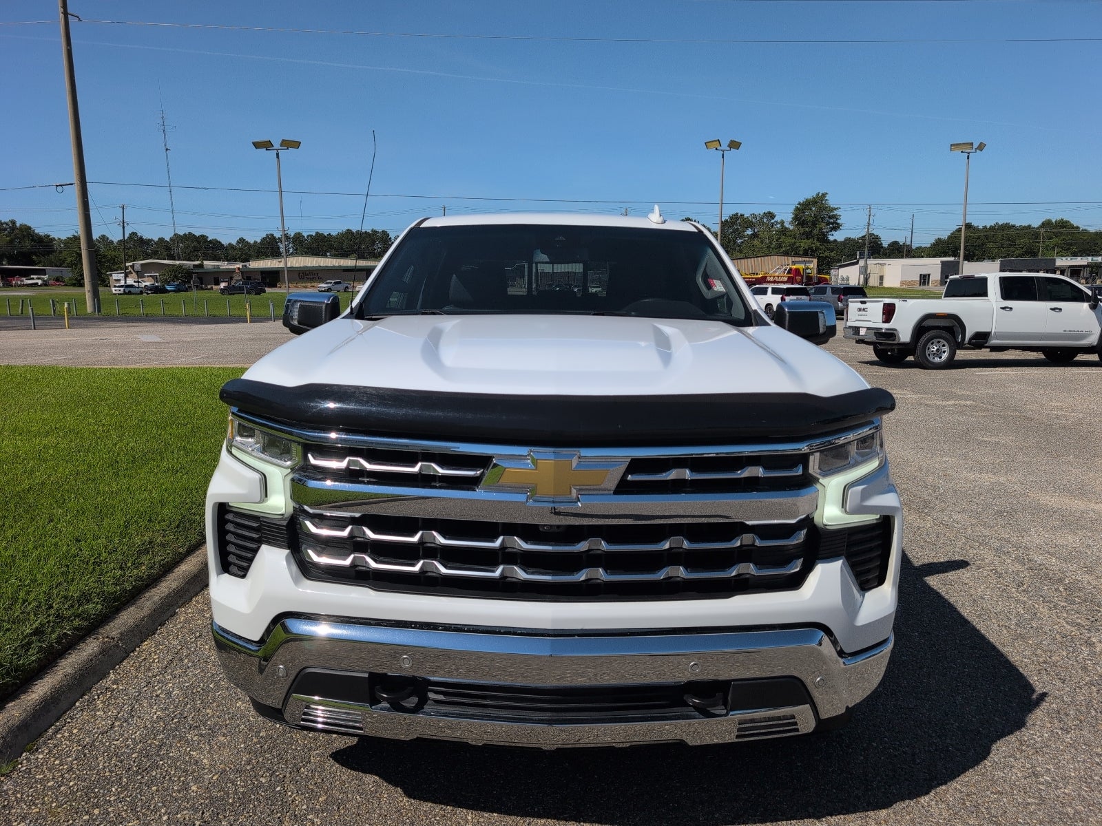 2022 Chevrolet Silverado 1500 LTZ in Summit White — front three-quarter view