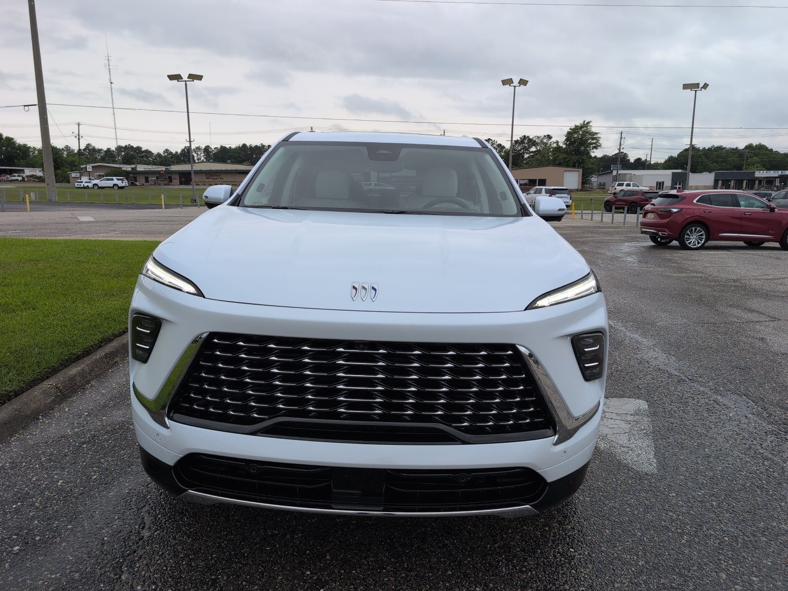 2026 Buick Enclave Avenir in Iridescent White Tricoat — front three-quarter view