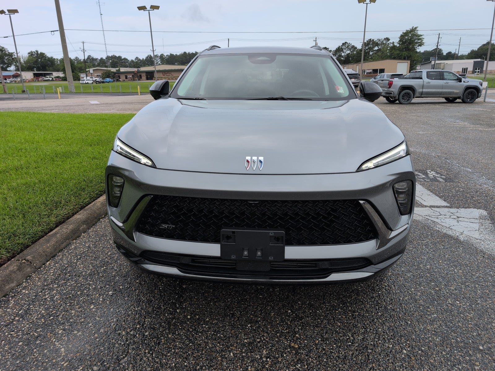 2025 Buick Envision Sport Touring in Moonstone Gray Metallic — front three-quarter view